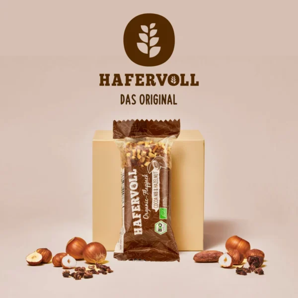 HAFERVOLL Organic Flapjack Cocoa Nib & Hazelnut 60g – Verpackung mit HAFERVOLL-Logo und Haselnüssen