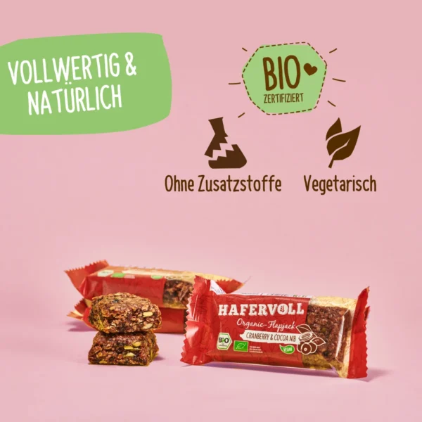 HAFERVOLL Organic Flapjack Cranberry & Cocoa Nib 60g – verpackt und ausgepackt mit Bio-Hinweisen