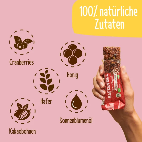 HAFERVOLL Organic Flapjack Cranberry & Cocoa Nib 60g – Riegel in der Hand mit Zutaten-Icons
